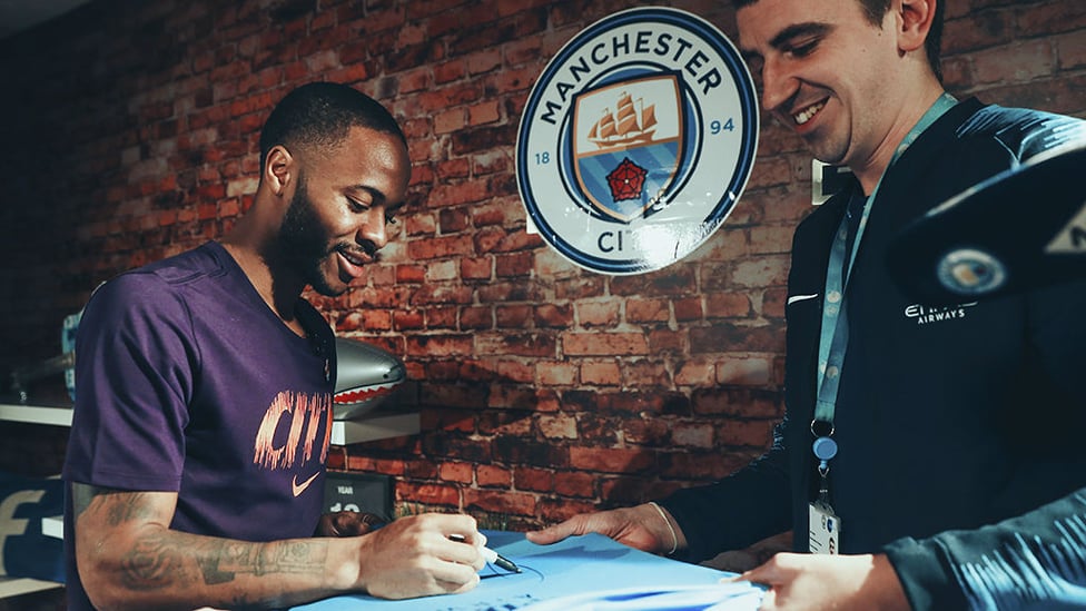 SIGNED AND SEALED : Raheem signs a City shirt following confirmation of his new contract