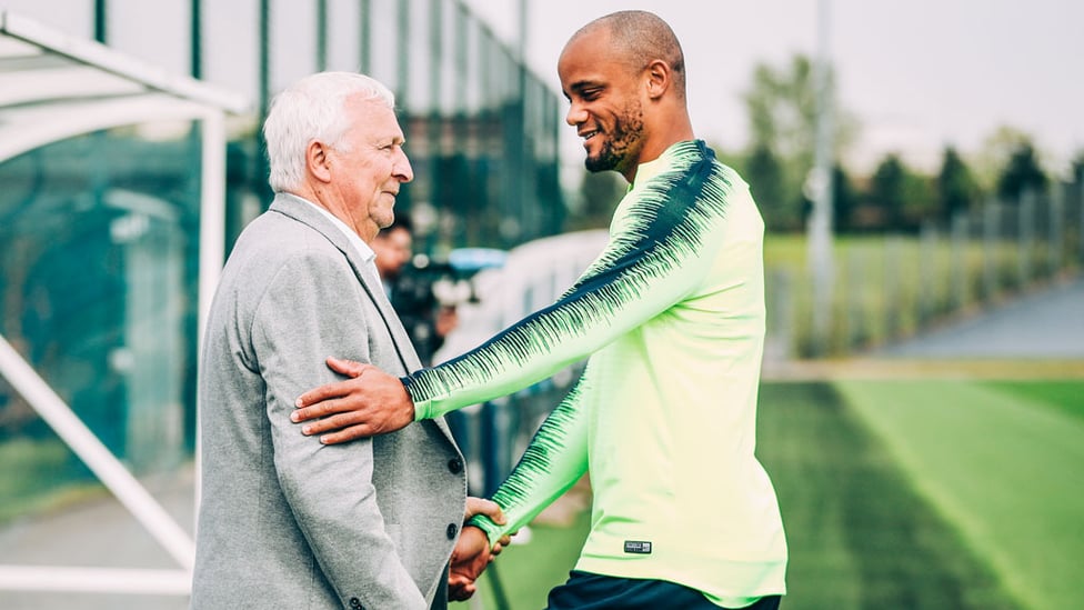 MEETING MIKE : Vincent Kompany chats with City legend Mike Summerbee