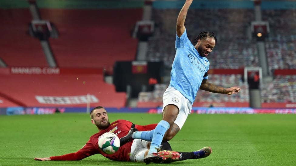 RAZZLE DAZZLE: Raheem Sterling battles for possession with Luke Shaw