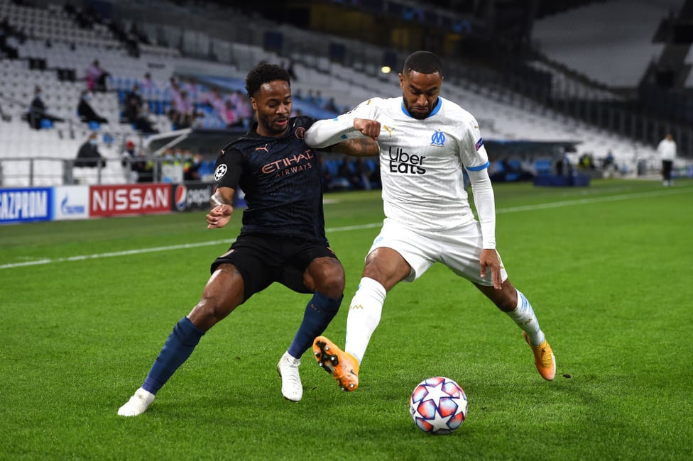 BATTLE : Sterling fights for possession 