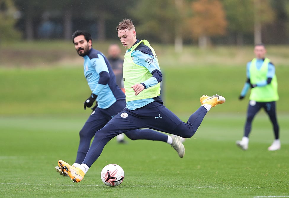 Cole Palmer, closely watched by Ilkay Gundogan