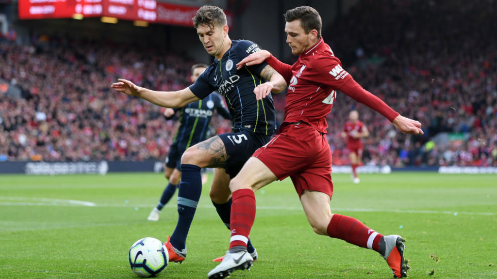 SOLID BLOCK: John Stones puts the squeeze on Andy Robertson