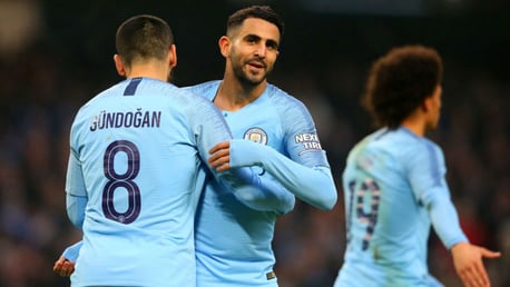 HIGH FIVES: Riyad Mahrez celebrates with Ilkay Gundogan after putting City 5-0 up