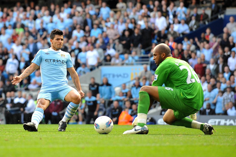 TREBLE : Sliding the ball past Wigan Athletic's Ali Al-Habsi for his first hat-trick for the Club.