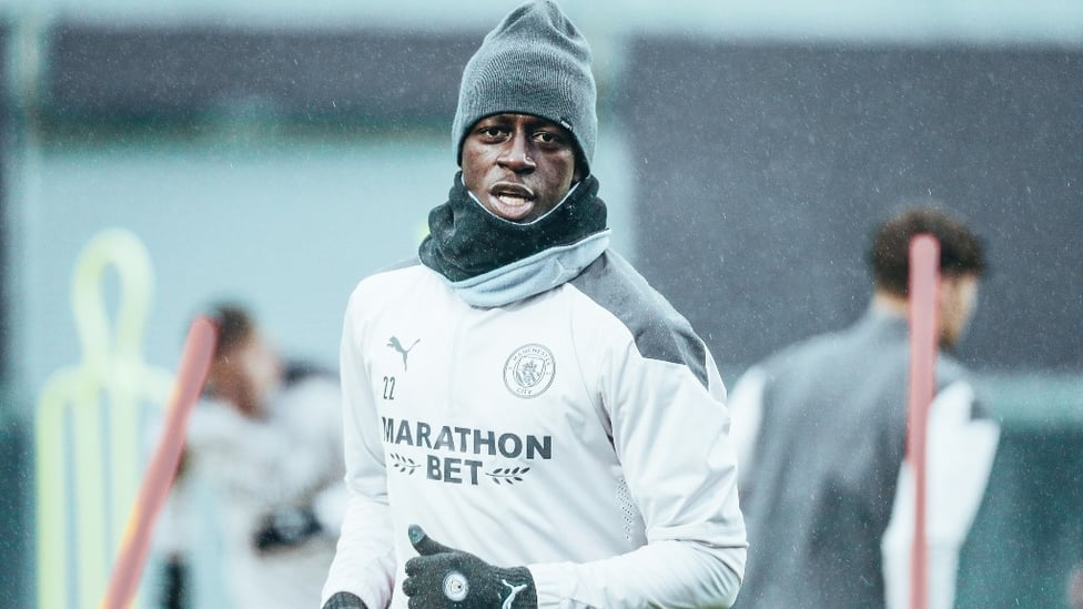 WRAPPED UP : A hat and snood helped Benjamin Mendy battle the elements.