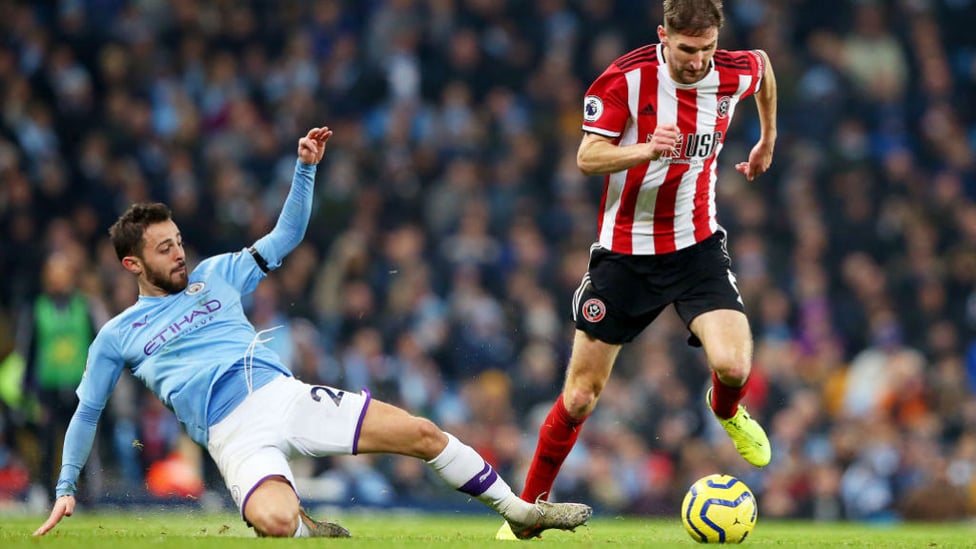 SILVA SLIDE : Bernardo battles for possession with Chris Basham