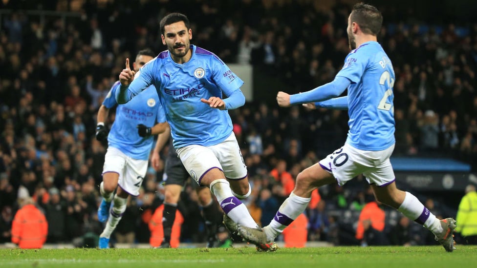 BACK OF THE NET : Gundogan wheels away to celebrate his successful spot kick.