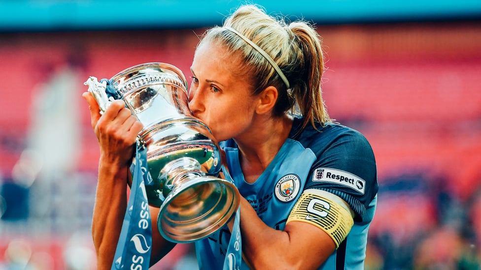 CUP CRACKER : Steph Houghton enjoys a special moment after City's Women's FA Cup triumph in 2017