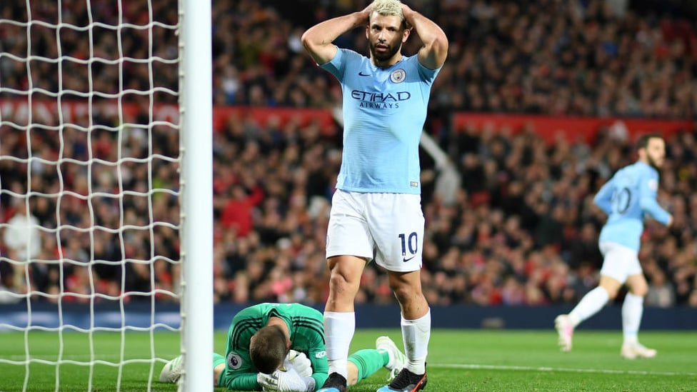 CLOSE CALL : Sergio Aguero can't hide his frustration after Raheem Sterling's goal-bound shot is saved by David De Gea