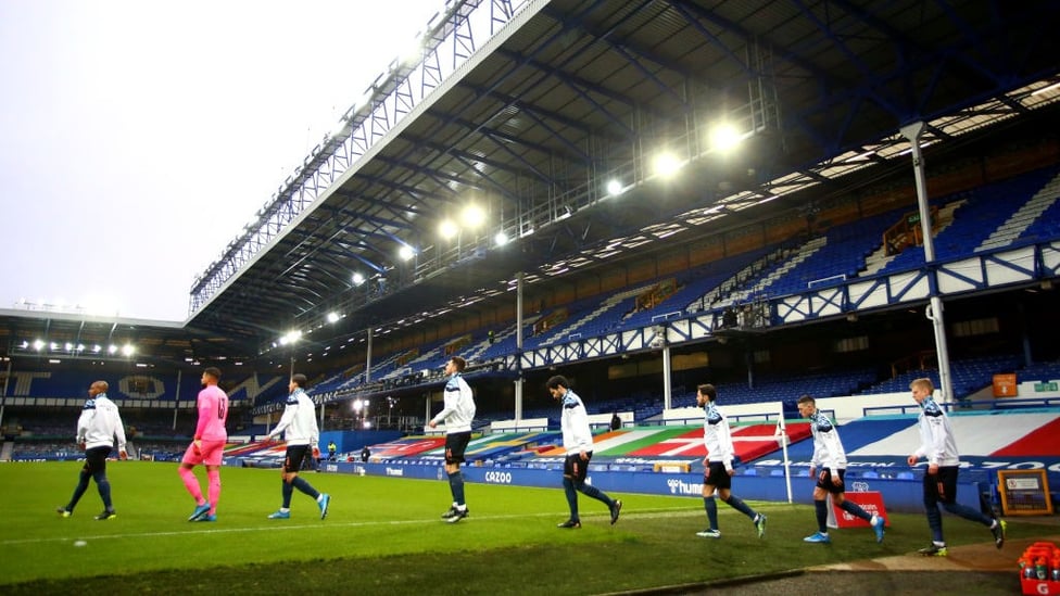 HERE WE GO : The lads make their way out onto the pitch ahead of kick-off.