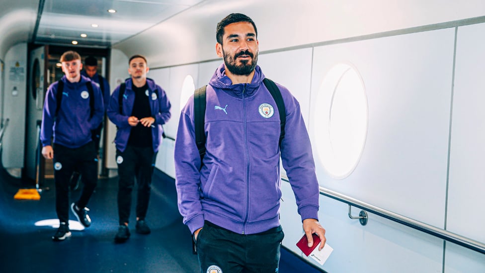 SILKY ILKAY : Gundogan looks cool as you like as he prepares to take his seat on the flight