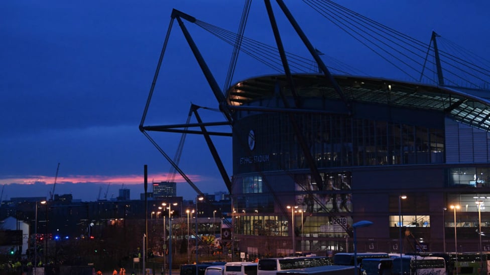 THE STAGE IS SET : The Etihad Stadium, silhouetted by a beautiful backdrop