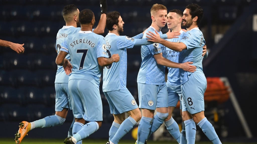 PERFECT START: The players rush over to congratulate Gundogan after his accurate finish.