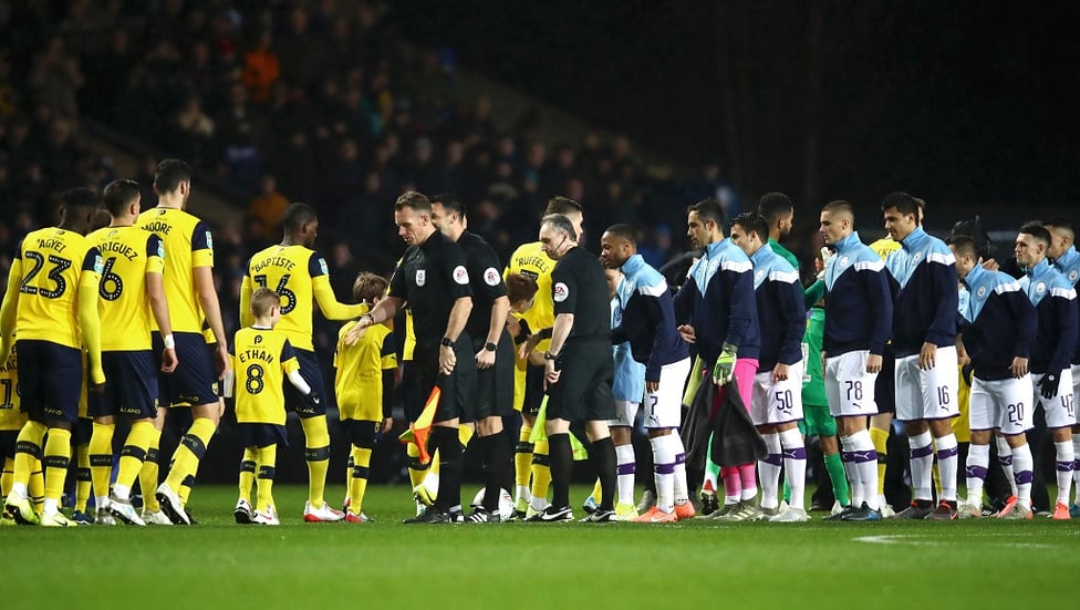 HANDSHAKES ALL-ROUND : Pre kick-off pleasantries