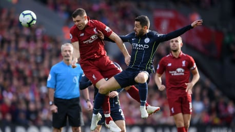 JUMP TO IT: Bernardo Silva challenges former City star James Milner