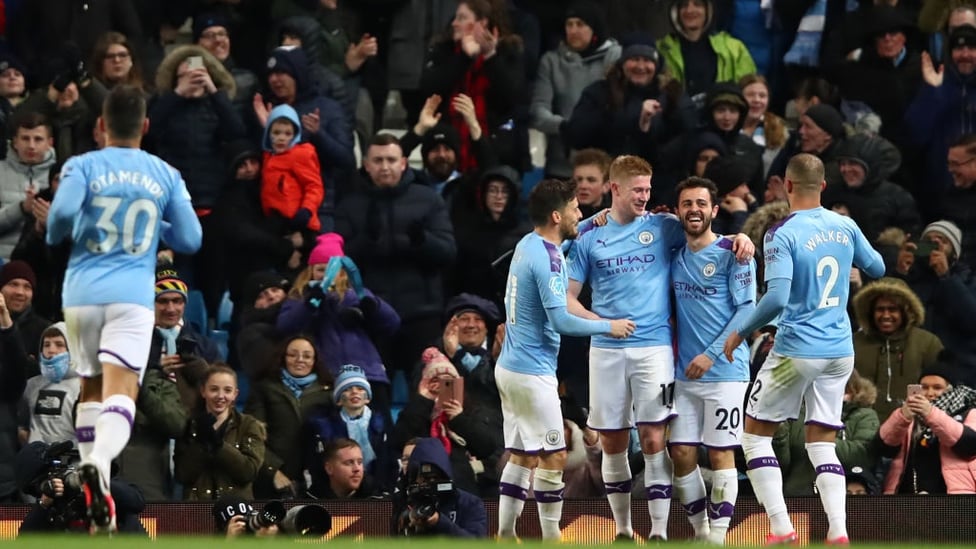 GROUP HUG : The players share the love after De Bruyne's powerful strike.