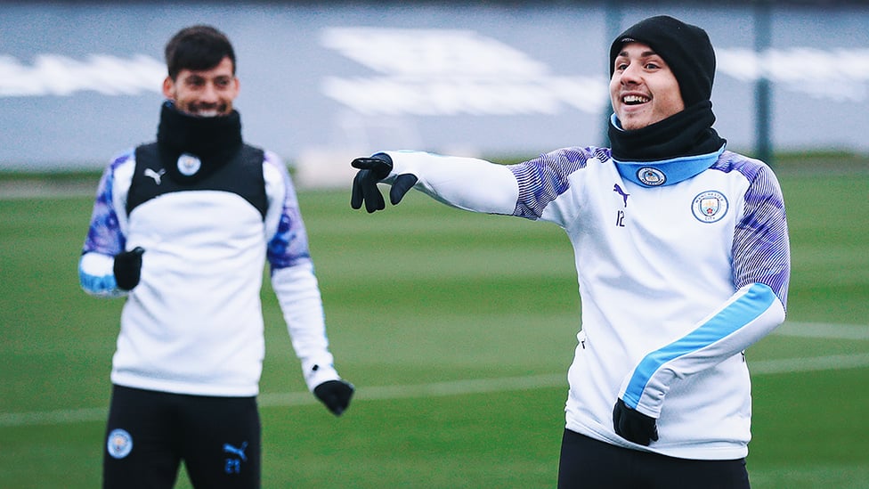 ON POINT : Angelino fires out a training pointer much to David Silva' s amusement