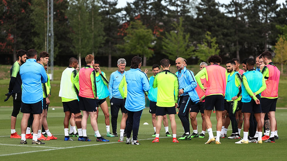 PEP TALK : The boss talks through the session with the squad as the countdown continues to Saturday's huge clash