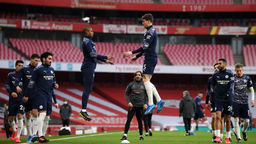 LEVITATING : Stones and Fernandinho hang in the air as the warm up winds down.