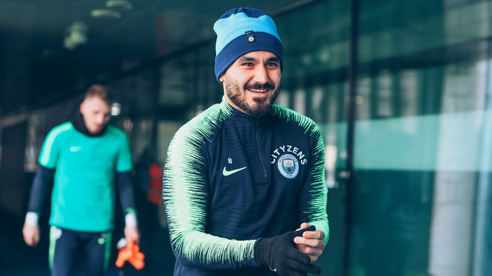 HAT TRICK : Ilkay Gundogan sports some nifty headwear to keep out the winter chill