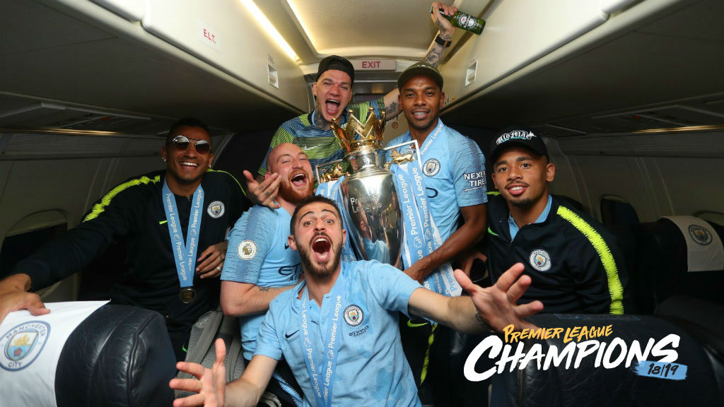 SOAR POINT: The City players celebrate their title success on the flight home from Brighton