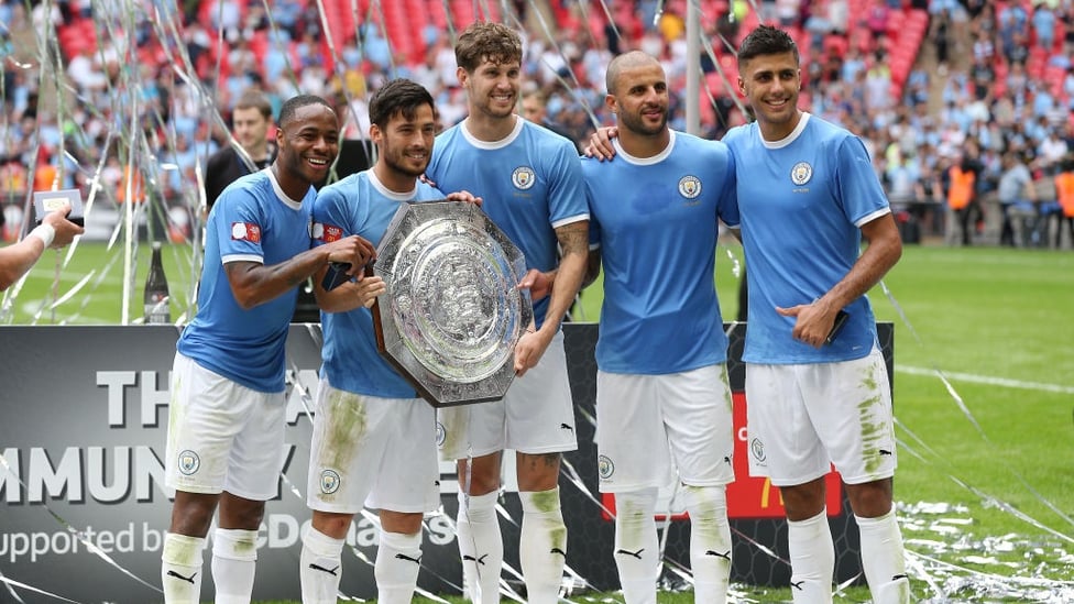 NEW ADDITION : City's stars pose for pictures with the newly-retained Community Shield.