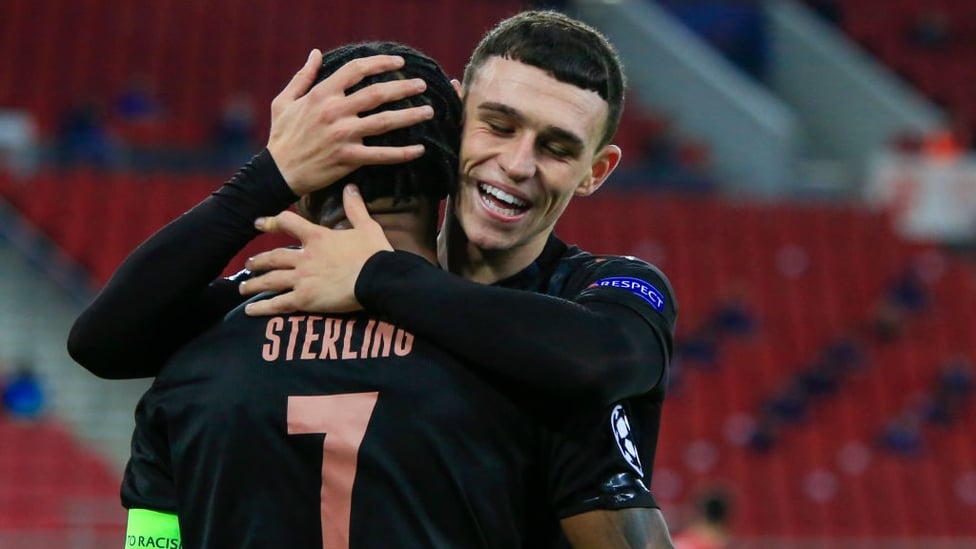 ALL SMILES : Foden embraces Sterling after the skipper's wonderful assist.