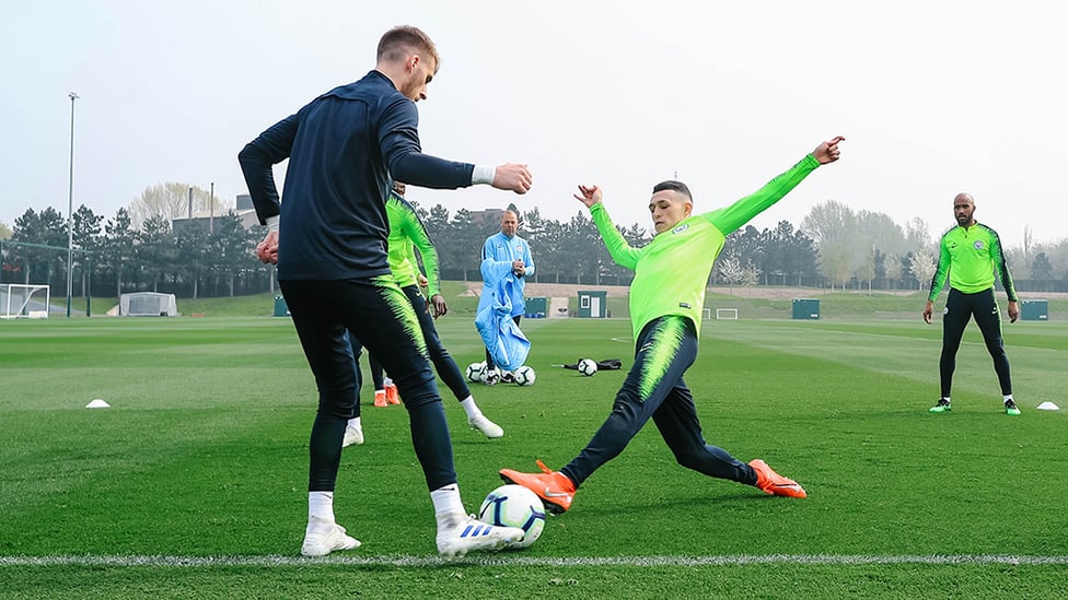 AT PHIL STRETCH : Phil Foden gets stuck in
