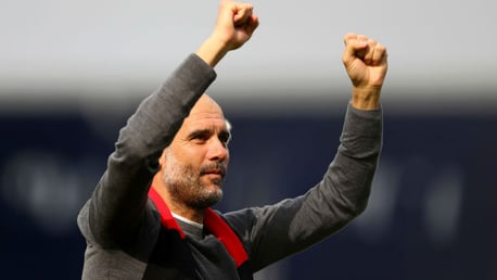 FITTING TRIBUTE: Pep Guardiola salutes the City fans wearing a red and black scarf in honour of Bernard Halford