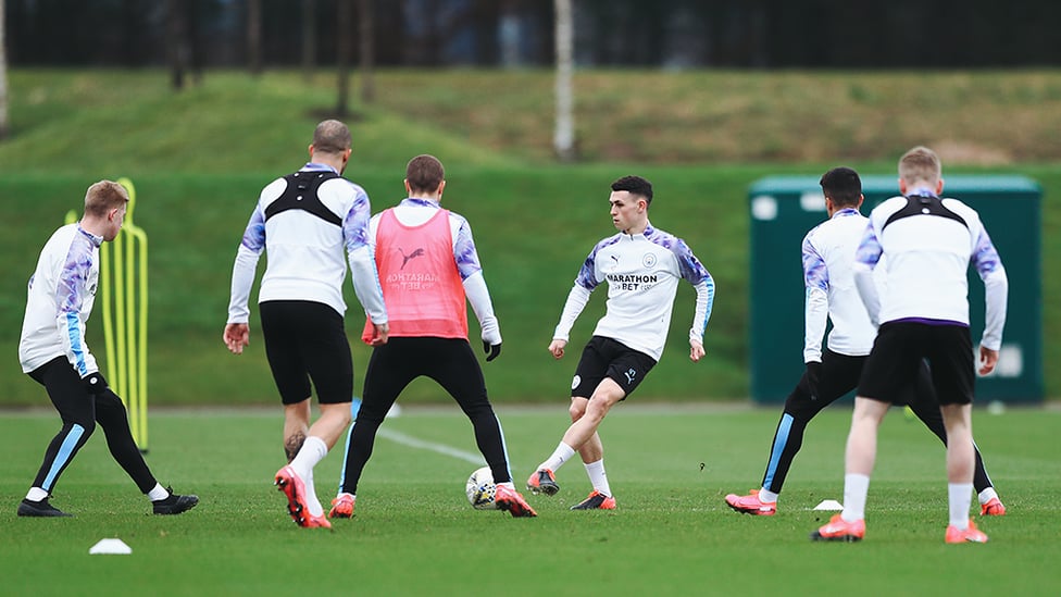 BEST FOOT FORWARD : Phil Foden and Co step up the tempo during a rondo session