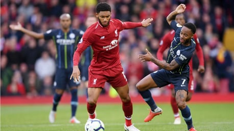 AT ARM'S LENGTH: Raheem Sterling looks to challenge Joe Gomez