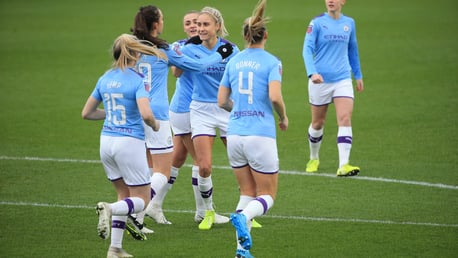 MOBBED: Steph Houghton celebrates after giving City an early lead against Brighton.