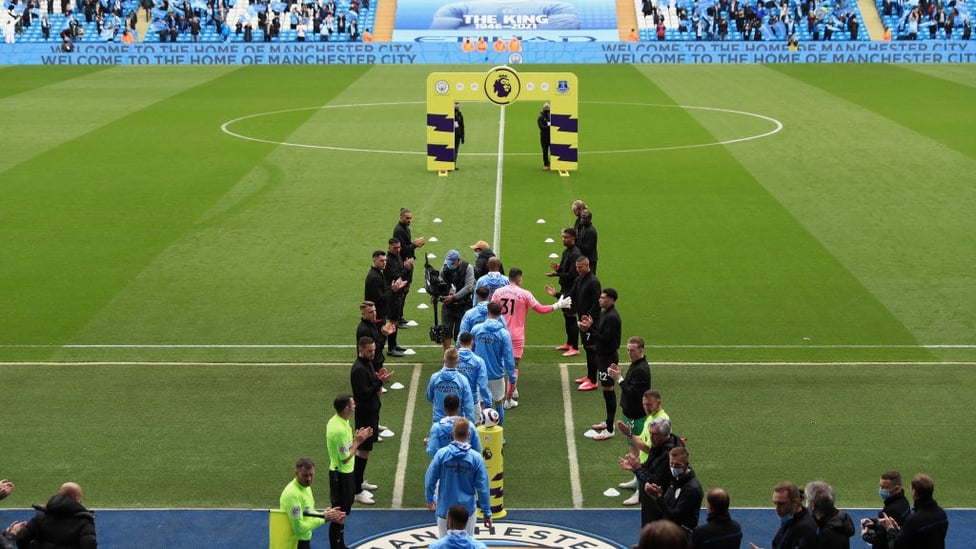 GUARD OF HONOUR : The Everton players, match officials and 10,000 City fans welcome the champions!