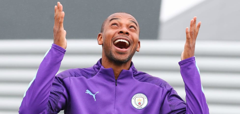 WET AND WINDY : Fernandinho making the most of the Manchester weather