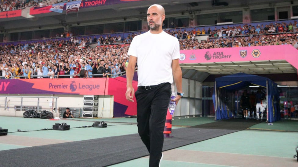 THE BOSS : Pep Guardiola watches on at the Nanjing Stadium