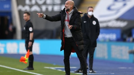 PEP TALK: The boss passes on some instructions from the touchline.