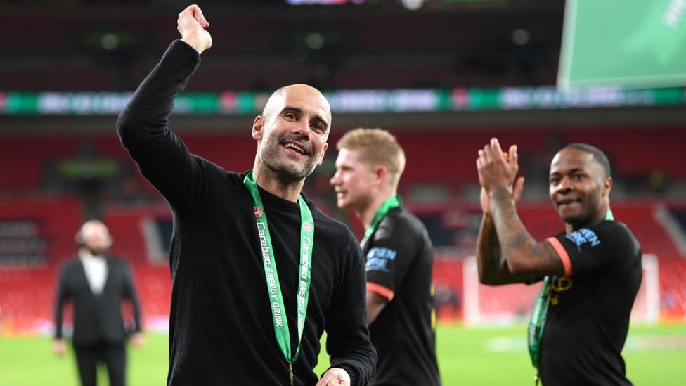 THE BOSS : Guardiola joins in the celebrations by appreciating the City fans.