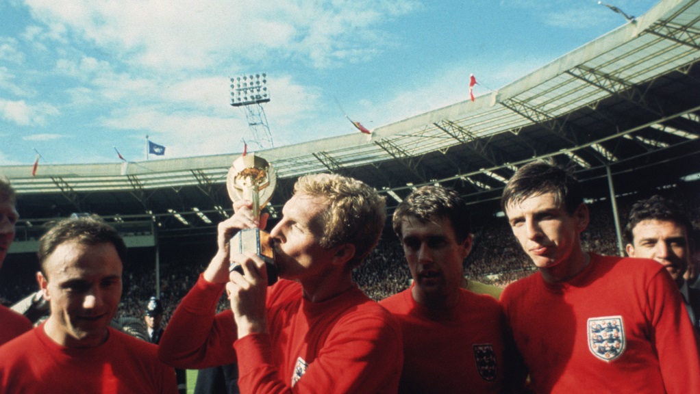 MOORE THAN THIS : Bobby kisses the Jules Rimet trophy