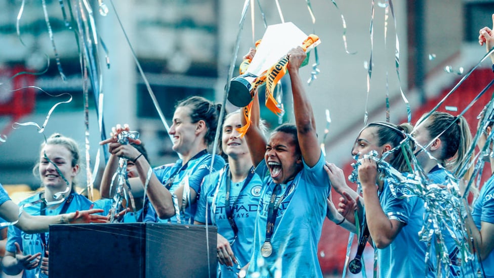 BLUE HEAVEN : Nikita Parris proudly holds the Continental Cup aloft in front of the travelling City fans