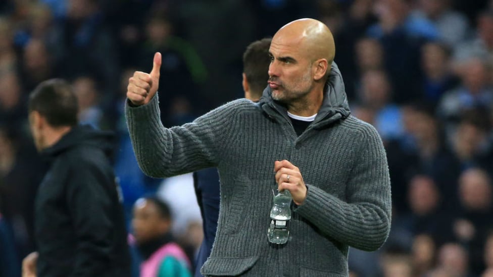LEADING MAN : Pep Guardiola gives his City players the thumbs-up