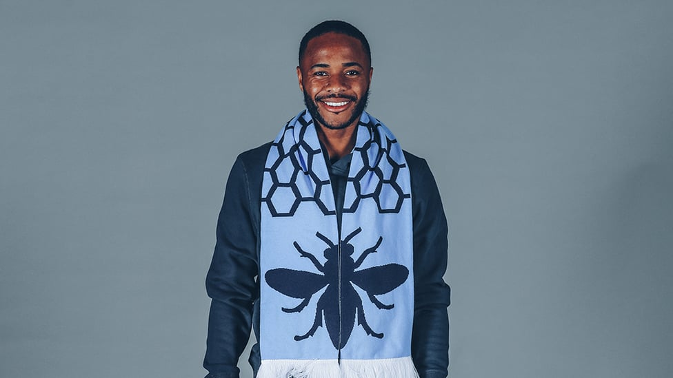 BEE HAPPY : Raheem with a special City scarf bearing the worker bee - the symbol of Manchester