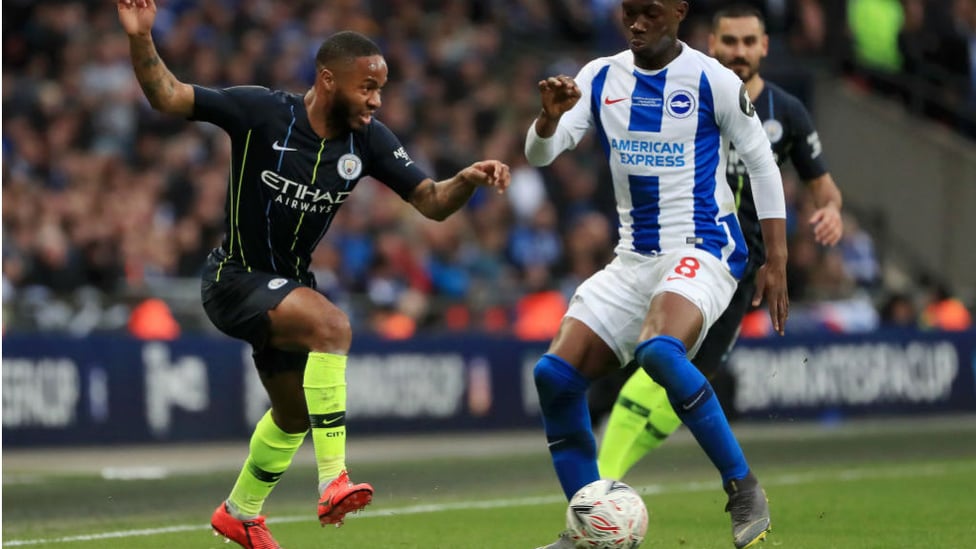 UP AND AT 'EM : Raheem Sterling takes on Brighton's Yves Bissouma