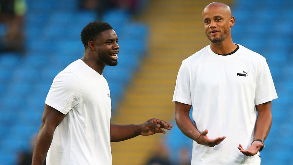 OLD FRIENDS : Newly-retired Micah Richards warms up with Vincent Kompany before his Testimonial kicks off