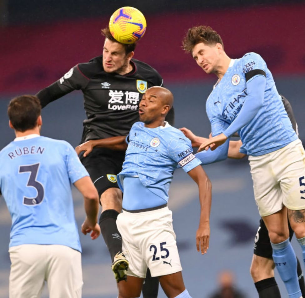 JUMP TO IT: John Stones and Fernandinho in the thick of the action