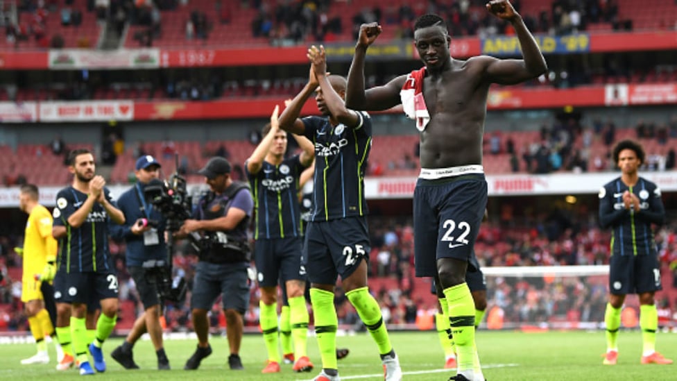 SOLID START : The team celebrate with the fans after the 2-0 win at the Emirates