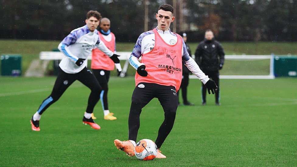 PHILLING THE GAPS: Phil Foden plays the ball into space