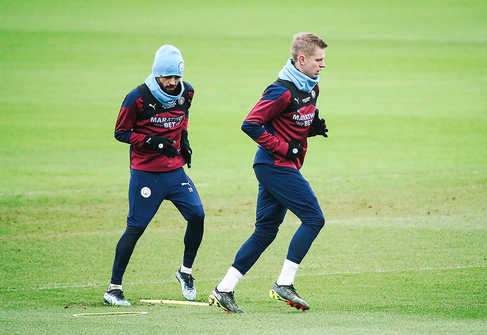 OUT IN FRONT : Oleksandr Zinchenko leads Bernardo Silva through a drill.