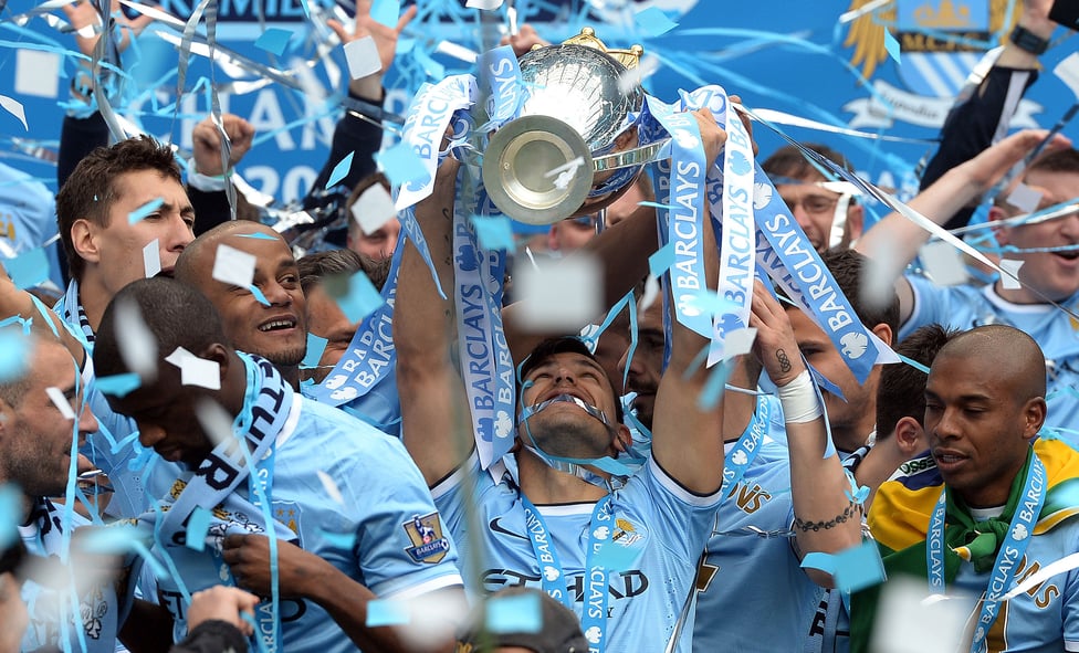 EYES ON THE PRIZE : Aguero looks up to the heavens after lifting the Premier League in 2014