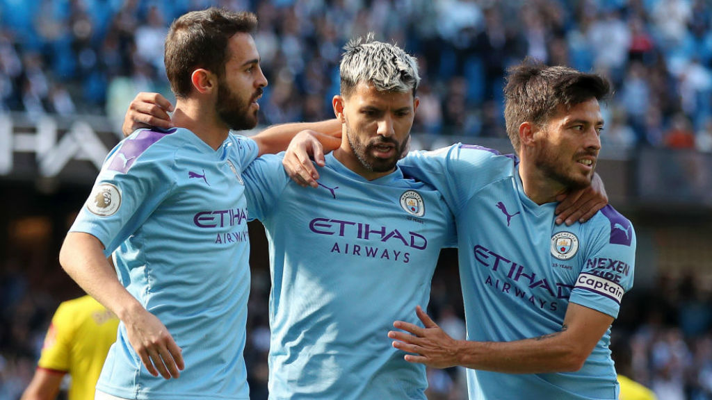 Bernardo and David Silva salute Sergio Aguero after his 100th goal at the Etihad