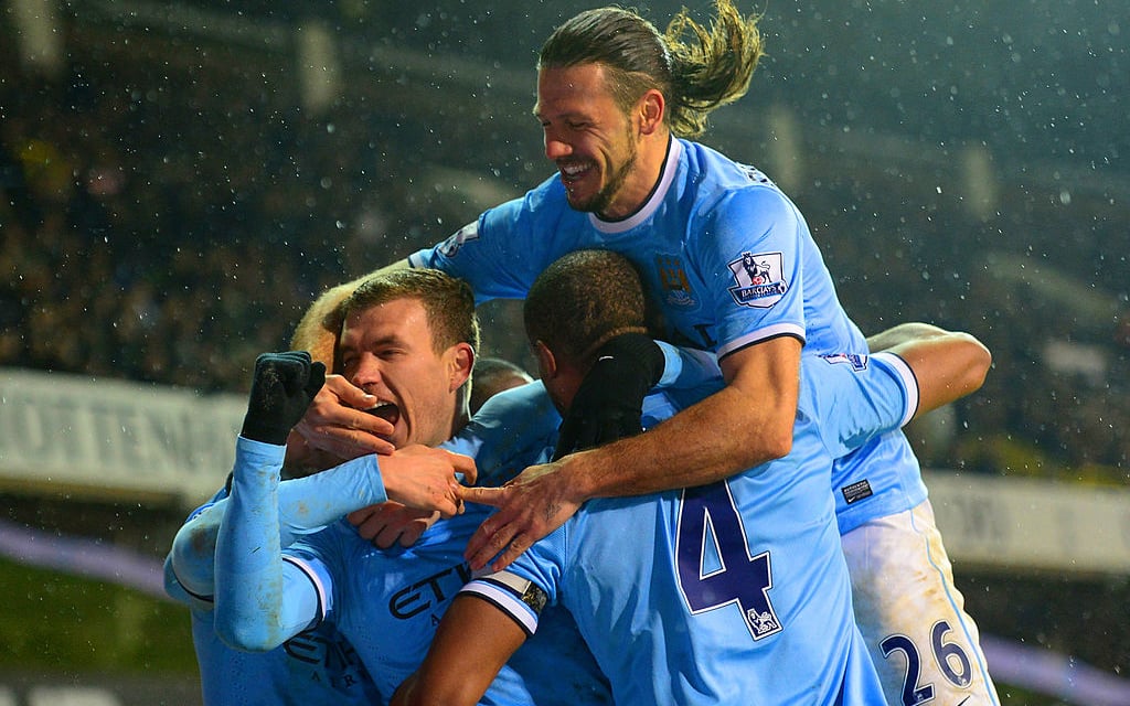 Edin Dzeko celebrates scoring against Spurs.